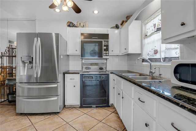 5300 Washington St Unit C113, Hollywood, FL 33021 - kitchen featuring stainless steel fridge with ice dispenser, range, ceiling fan, and white cabinets