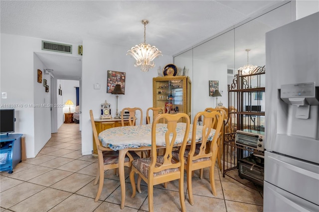 5300 Washington St Unit C113, Hollywood, FL 33021 - dining room with a chandelier and light tile patterned floors