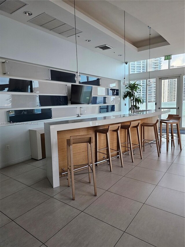 1900 N Bayshore Dr Unit 1803, Miami, FL 33132 - kitchen featuring light tile patterned flooring, decorative light fixtures, and light countertops
