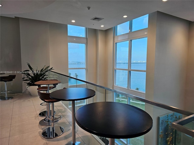 1900 N Bayshore Dr Unit 1803, Miami, FL 33132 - tiled dining room with healthy amount of natural light, a water view, and recessed lighting