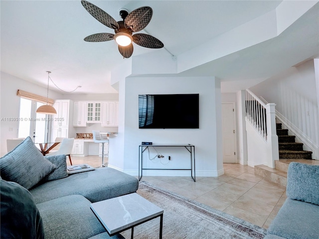 1900 Oceanwalk Ln Unit 123, Lauderdale By The Sea, FL 33062 - living area with stairway, ceiling fan, and light tile patterned floors
