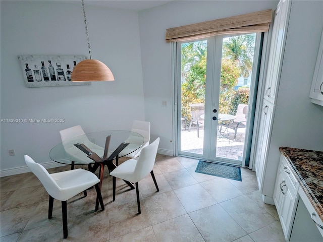 1900 Oceanwalk Ln Unit 123, Lauderdale By The Sea, FL 33062 - dining area with french doors and light tile patterned floors