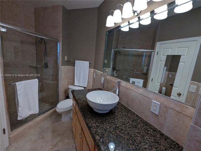 1900 Oceanwalk Ln Unit 123, Lauderdale By The Sea, FL 33062 - full bathroom featuring vanity, a shower stall, a chandelier, and tile patterned flooring