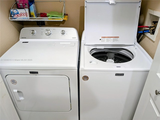 1900 Oceanwalk Ln Unit 123, Lauderdale By The Sea, FL 33062 - laundry area with washing machine and clothes dryer