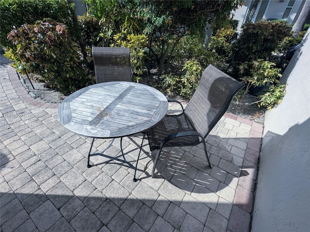1900 Oceanwalk Ln Unit 123, Lauderdale By The Sea, FL 33062 - view of patio / terrace with outdoor dining space