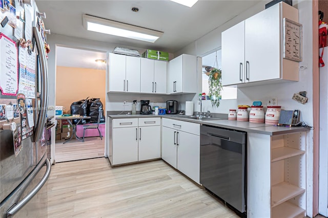3991 NW 108th Ave, Coral Springs, FL 33065 - kitchen with appliances with stainless steel finishes, open shelves, white cabinets, and light wood finished floors