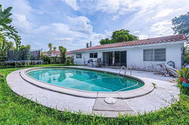 3991 NW 108th Ave, Coral Springs, FL 33065 - view of swimming pool with a trampoline and a patio area