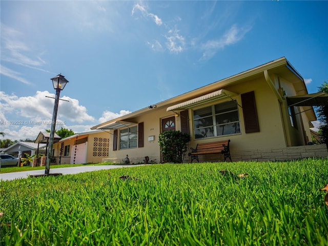 2918 NW 46th St, Tamarac, FL 33309 - view of front facade featuring stucco siding