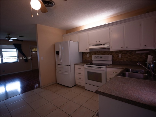 2918 NW 46th St, Tamarac, FL 33309 - kitchen featuring white appliances, a ceiling fan, under cabinet range hood, white cabinetry, and a textured ceiling