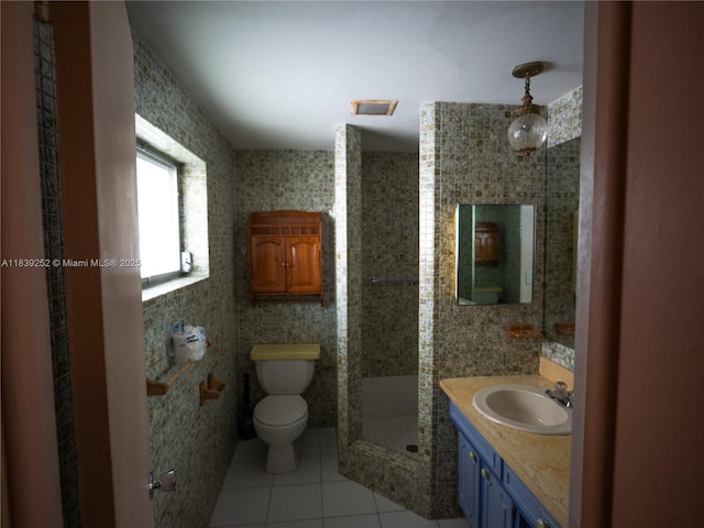 2918 NW 46th St, Tamarac, FL 33309 - bathroom featuring tile patterned floors, vanity, a shower stall, and tile walls