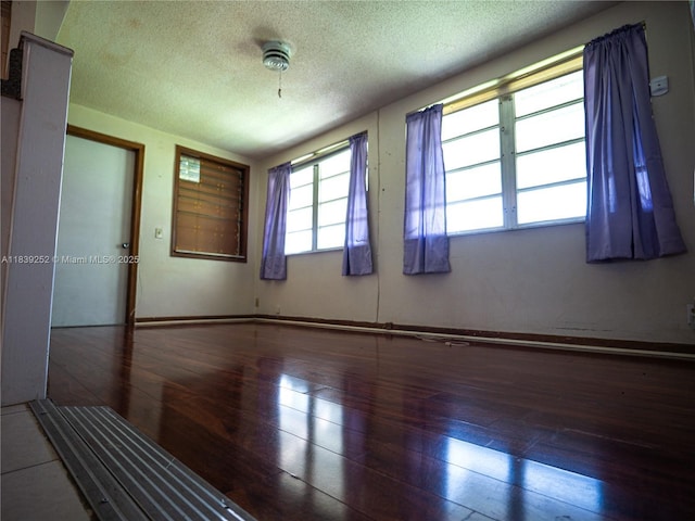 2918 NW 46th St, Tamarac, FL 33309 - unfurnished room with hardwood / wood-style flooring and a textured ceiling