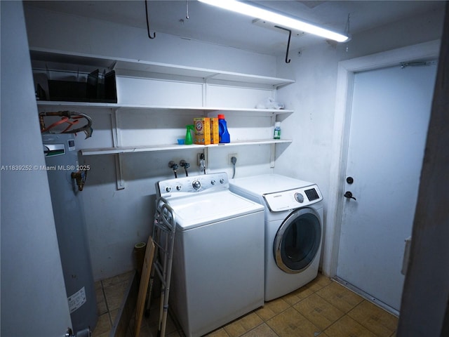 2918 NW 46th St, Tamarac, FL 33309 - laundry area featuring washer and clothes dryer and water heater