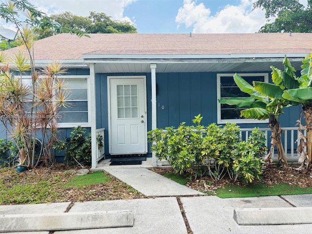 4710 NW 3rd Ter, Deerfield Beach, FL 33064 - property entrance featuring board and batten siding and roof with shingles