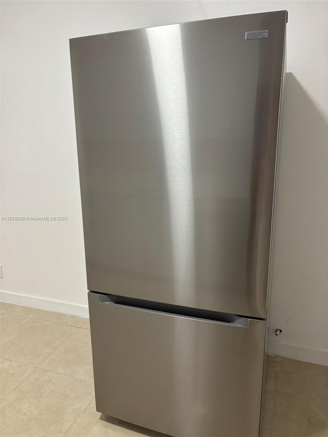 4710 NW 3rd Ter, Deerfield Beach, FL 33064 - kitchen view of freestanding refrigerator and baseboards