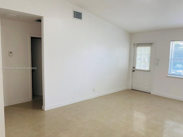 4710 NW 3rd Ter, Deerfield Beach, FL 33064 - empty room featuring baseboards