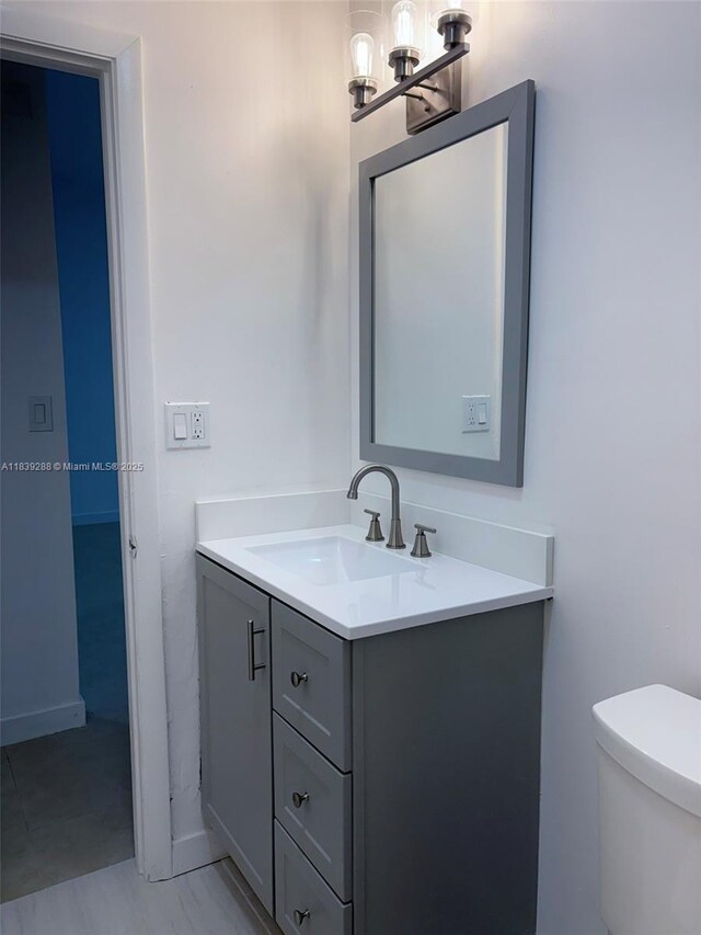 4710 NW 3rd Ter, Deerfield Beach, FL 33064 - bathroom with vanity and a chandelier