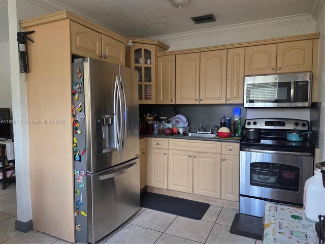 2936 NW 47th St, Miami, FL 33142 - kitchen featuring appliances with stainless steel finishes, light brown cabinetry, dark countertops, glass insert cabinets, and crown molding