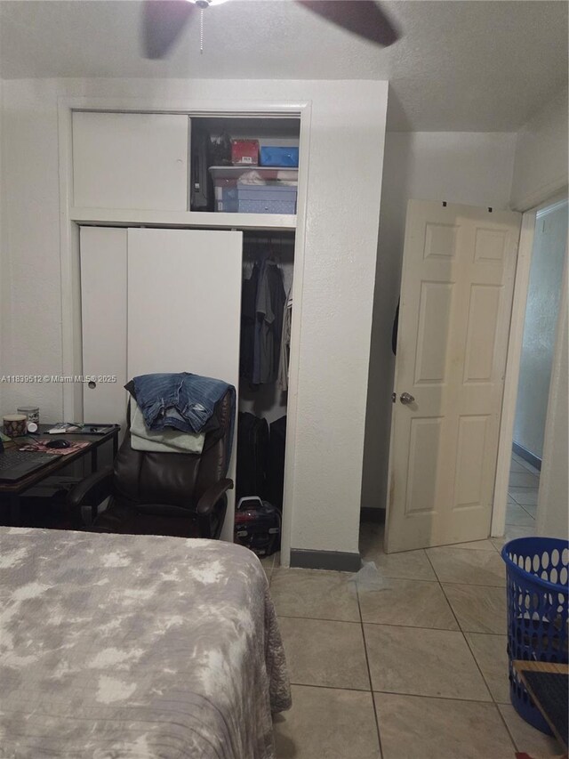 2936 NW 47th St, Miami, FL 33142 - tiled bedroom featuring a closet and ceiling fan