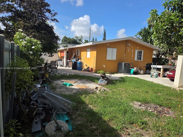 2936 NW 47th St, Miami, FL 33142 - back of house with a patio area, a fenced backyard, and stucco siding