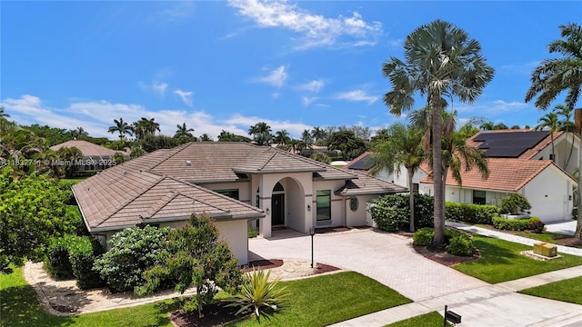 17809 Southwick Way, Boca Raton, FL 33498 - view of front of house with decorative driveway, stucco siding, a tiled roof, and a front lawn
