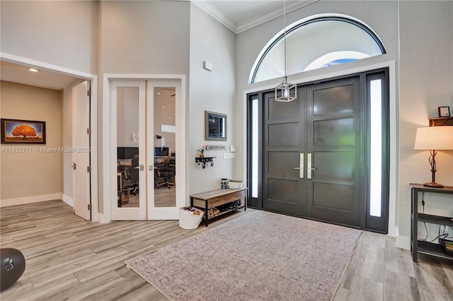 17809 Southwick Way, Boca Raton, FL 33498 - foyer entrance with french doors, ornamental molding, wood finished floors, and a high ceiling