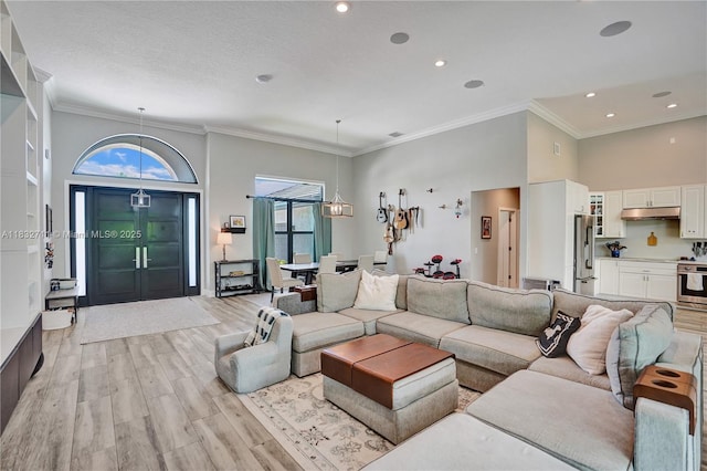 17809 Southwick Way, Boca Raton, FL 33498 - living area featuring a chandelier, light wood-style flooring, ornamental molding, recessed lighting, and a high ceiling