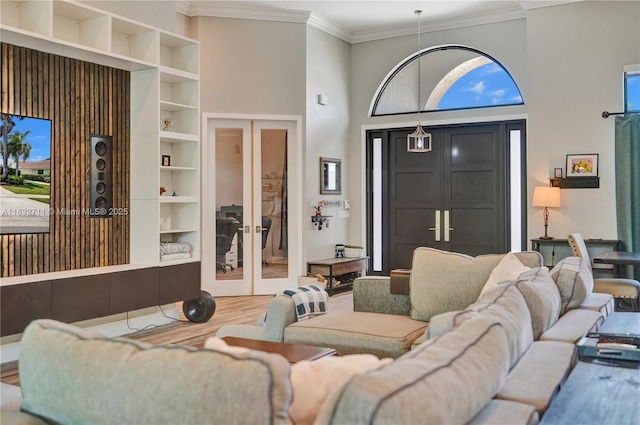 17809 Southwick Way, Boca Raton, FL 33498 - living room with crown molding, wood finished floors, built in features, french doors, and healthy amount of natural light