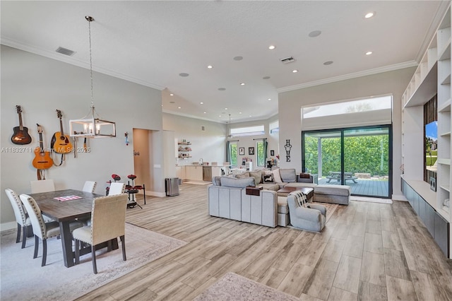 17809 Southwick Way, Boca Raton, FL 33498 - living area featuring crown molding, recessed lighting, a chandelier, light wood-type flooring, and a high ceiling