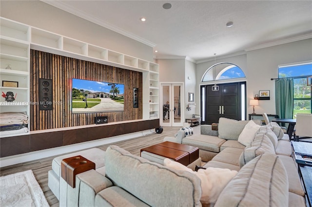 17809 Southwick Way, Boca Raton, FL 33498 - living room with built in features, wood finished floors, crown molding, recessed lighting, and a textured ceiling