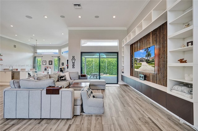 17809 Southwick Way, Boca Raton, FL 33498 - living area featuring crown molding, recessed lighting, healthy amount of natural light, built in features, and wood finished floors