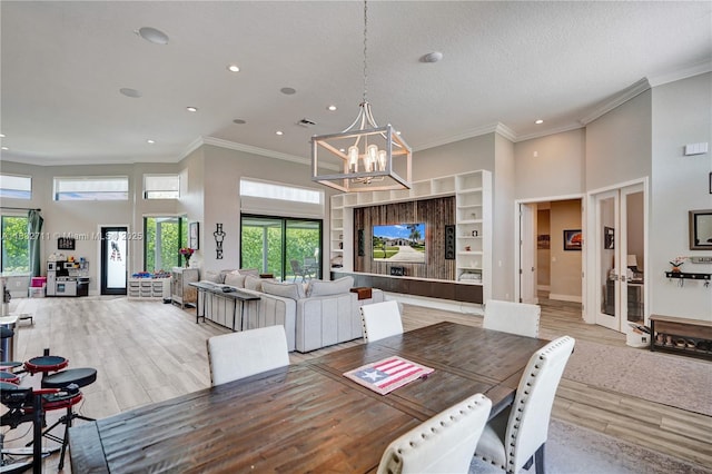 17809 Southwick Way, Boca Raton, FL 33498 - dining area featuring a chandelier, recessed lighting, healthy amount of natural light, wood finished floors, and a high ceiling