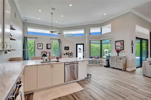 17809 Southwick Way, Boca Raton, FL 33498 - kitchen featuring dishwasher, open floor plan, ornamental molding, ceiling fan, and light stone countertops