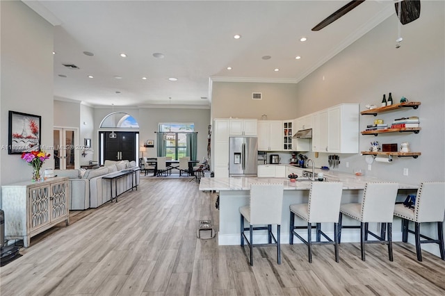 17809 Southwick Way, Boca Raton, FL 33498 - kitchen featuring stainless steel refrigerator with ice dispenser, a peninsula, crown molding, white cabinetry, and glass insert cabinets