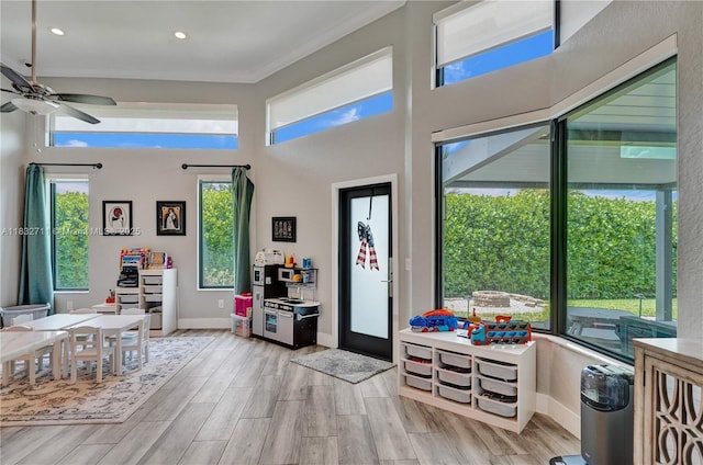 17809 Southwick Way, Boca Raton, FL 33498 - foyer featuring ceiling fan, a high ceiling, light wood finished floors, crown molding, and recessed lighting