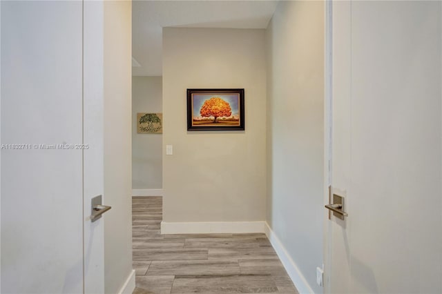 17809 Southwick Way, Boca Raton, FL 33498 - hallway featuring light wood-style floors and baseboards