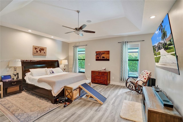 17809 Southwick Way, Boca Raton, FL 33498 - bedroom featuring a raised ceiling, wood finished floors, recessed lighting, and a ceiling fan