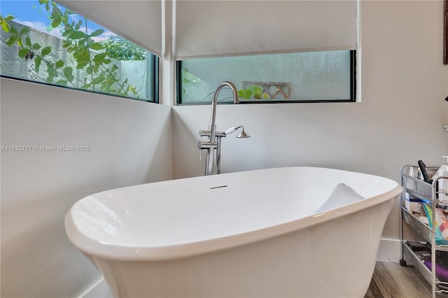 17809 Southwick Way, Boca Raton, FL 33498 - full bathroom featuring a freestanding tub and wood finished floors