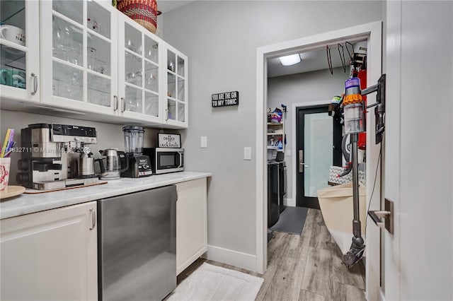 17809 Southwick Way, Boca Raton, FL 33498 - bar featuring fridge, light wood-style floors, and stainless steel microwave
