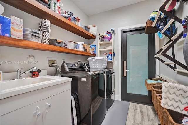 17809 Southwick Way, Boca Raton, FL 33498 - laundry room with washing machine and clothes dryer, cabinet space, and wood finished floors