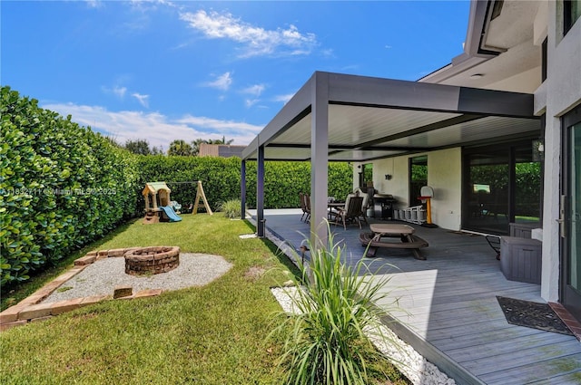 17809 Southwick Way, Boca Raton, FL 33498 - view of green lawn featuring a fire pit, a playground, a patio, and a deck