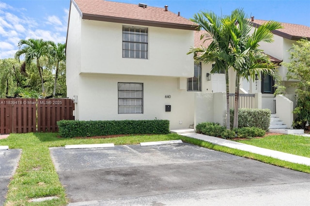 640 NW 98th Ct Unit 640, Miami, FL 33172 - view of front facade with uncovered parking and stucco siding