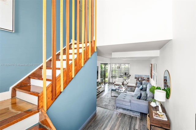 640 NW 98th Ct Unit 640, Miami, FL 33172 - staircase with wood finished floors and a towering ceiling