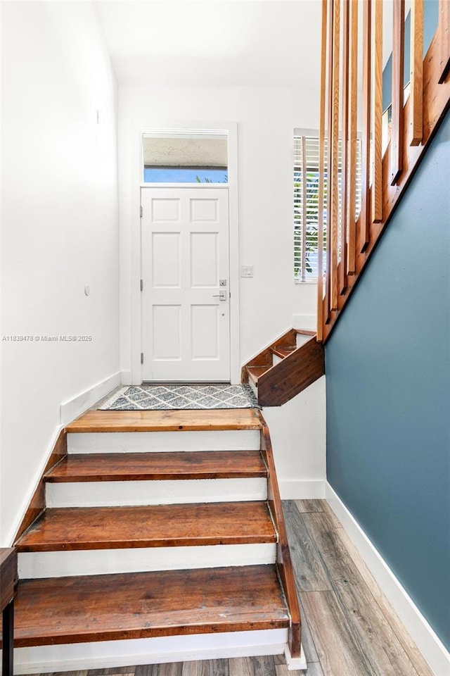 640 NW 98th Ct Unit 640, Miami, FL 33172 - staircase featuring wood finished floors and baseboards