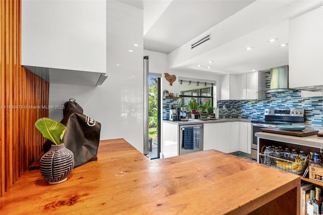 640 NW 98th Ct Unit 640, Miami, FL 33172 - kitchen with stainless steel electric range, modern cabinets, beverage cooler, wall chimney range hood, and recessed lighting