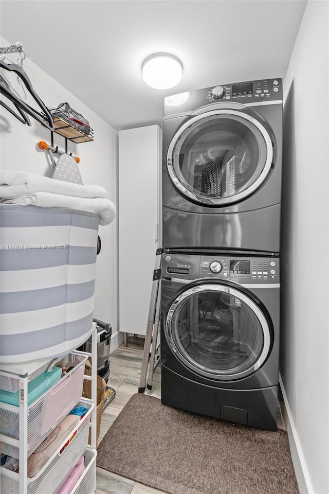640 NW 98th Ct Unit 640, Miami, FL 33172 - laundry room featuring estacked washer and dryer and baseboards