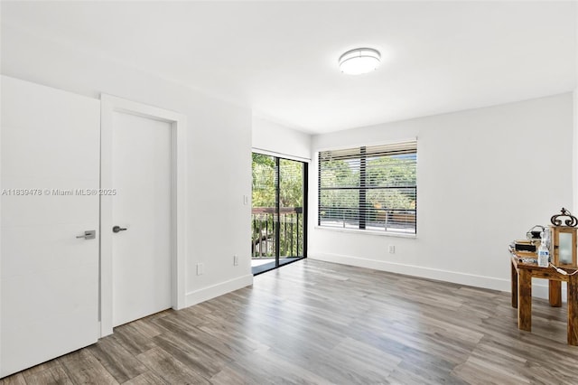 640 NW 98th Ct Unit 640, Miami, FL 33172 - unfurnished bedroom with access to outside and wood finished floors