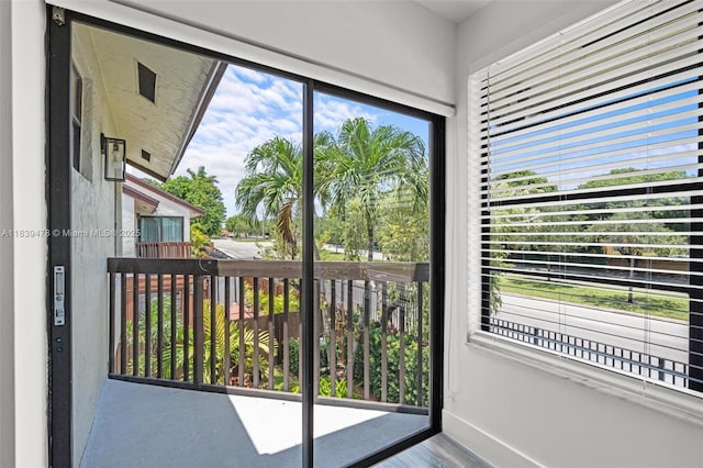 640 NW 98th Ct Unit 640, Miami, FL 33172 - doorway to outside featuring baseboards and wood finished floors