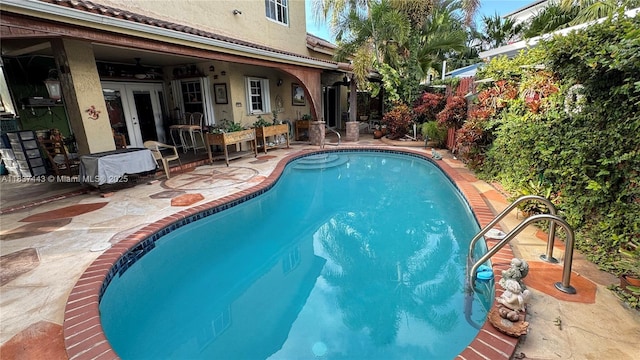 15588 SW 62nd St, Miami, FL 33193 - outdoor pool with a patio area and french doors