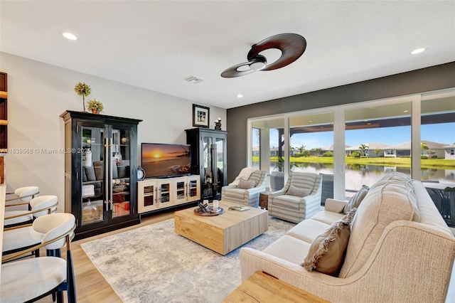 15734 SW Egret Coast Dr, Port St Lucie, FL 34987 - living area with ceiling fan, wood finished floors, and recessed lighting