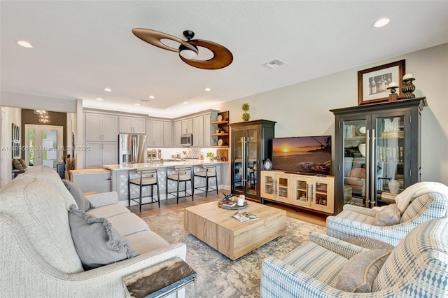 15734 SW Egret Coast Dr, Port St Lucie, FL 34987 - living area with recessed lighting, light wood-type flooring, and ceiling fan